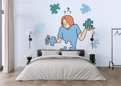 Confused young woman with jigsaw puzzles rebuild personality or identity. Frustrated unhappy girl recover from depression or mental psychological problems. Rehabilitation. Vector illustration.  Wall mural