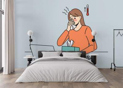 Feeling fever and ill concept. Young woman worker cartoon character sitting in office at laptop having high temperature and sick vector illustration  Wall mural