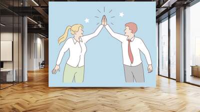 Giving five and collaboration concept. Young positive man and woman cartoon characters business partners standing giving five to each other working in team cooperating in work  Wall mural