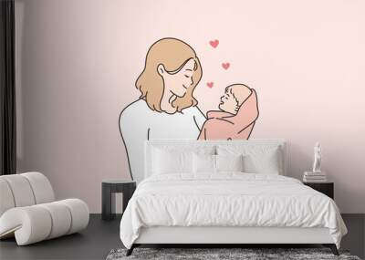 Happy motherhood and childhood concept. Young and happy mom mother woman cartoon character standing holding her baby little newborn son or daughter vector illustration Wall mural