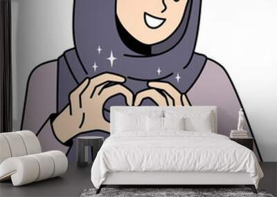 Smiling Arabic woman show heart gesture Wall mural