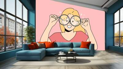 Smiling girl in big glasses for sight correction. Happy child wear spectacles for better eyesight. Optics concept. Vector illustration.  Wall mural