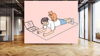 Sporty woman stand in plank, lazy cat sitting on back. Toned active girl follow healthy lifestyle do sports with online training lesson or class on computer at home on lockdown. Vector illustration.  Wall mural