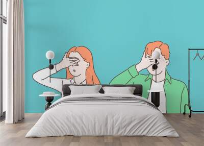 Turning blind eye cartoon concept. Woman and man closing eyes with palm gesture, looking through fingers, people refusing to watch, peeking, avoiding seeing evident facts. Simple flat vector Wall mural