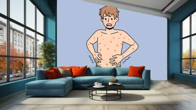 Unhealthy boy with red spots on body suffer from measles or rubella. Anxious unwell man struggle with rash fever, have severe symptoms. Healthcare concept. Flat vector illustration.  Wall mural