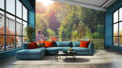 Girl in a kayak and sunny weather, panorama Wall mural