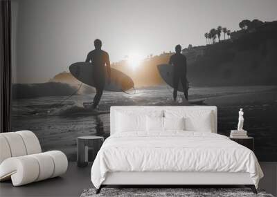 Surfers Walking Back to Shore at Sunset Wall mural