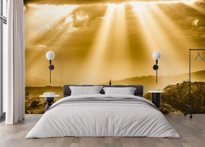 Sun rays shining down on a Church. Sepia color. Wall mural