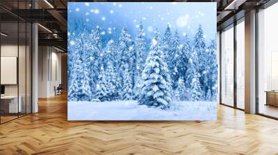 Christmas holiday background. Winter scene. Snowfall in winter forest Wall mural