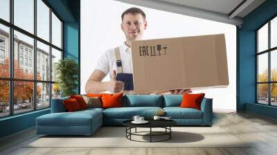 Relocation services concept. Mover man with cardboard box in hands Wall mural