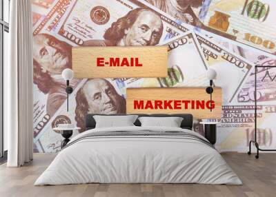 Against the background of dollar bills, the text is written on wooden blocks - email marketing Wall mural