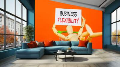 Business flexibility symbol. Concept words Business flexibility on beautiful white paper. Beautiful orange background. Businessman model in pushcart. Business flexibility concept. Copy space. Wall mural