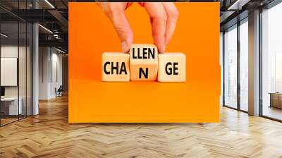 Challenge and change symbol. Concept word Challenge Change on wooden cubes. Businessman hand. Beautiful orange table orange background. Business and challenge and change concept. Copy space. Wall mural