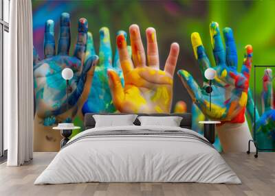 Childrens Hands Covered in Colorful Paint Wall mural