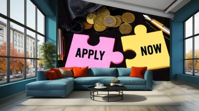 Coins are scattered on the black surface, there is a pen and puzzles on which it is written - APPLY NOW Wall mural