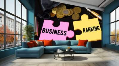 Coins are scattered on the black surface, there is a pen and puzzles on which it is written - BUSINESS RANKING Wall mural