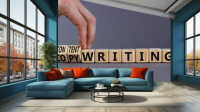 Content writing or copywriting symbol. Businessman turns cubes changes words content writing to copywriting. Beautiful grey background copy space. Business Content writing or copywriting concept. Wall mural