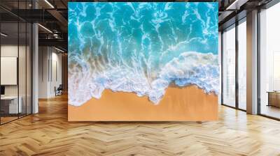 From above, it is an abstract sand beach with light blue transparent water waves and sun light, a summer vacation background with copy space, and a natural beauty spa in the outdoors. Wall mural