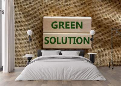 Green solution symbol. Wooden blocks form the words 'green solution' on beautiful canvas background. Business, ecological and green solution concept. Copy space. Wall mural