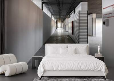 Empty retail space with a black ceiling and a dirty floor, immediately after repair Wall mural