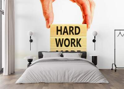 Hard work mode symbol. Concept words Hard work mode on wooden block on a beautiful white table white background. Businessman hand. Business and Hard work mode concept. Copy space. Wall mural