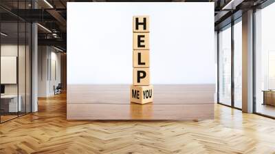 Help you or me symbol. Turned wooden cubes and changed words help me to help you. Beautiful wooden table, white background, copy space. Business, motivational and help you or me concept. Wall mural