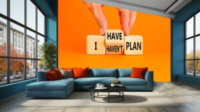 I have or not plan symbol. Concept word I have or have not plan on beautiful wooden cubes. Beautiful orange table orange background. Businessman hand. Business i have or not plan concept. Copy space. Wall mural