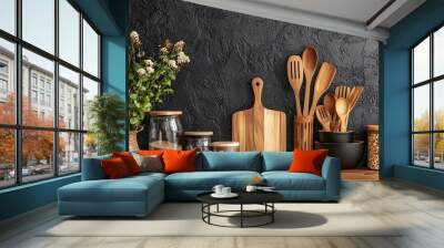 In this modern kitchen interior, wooden countertops, cutting boards, and potted plants are combined with stylish utensils in holders and sleek, minimalistic design elements. Wall mural