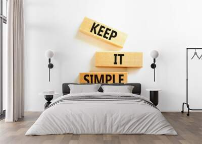 Keep it simple symbol. Concept word Keep it simple on beautiful wooden block. Beautiful white table white background. Business motivational keep it simple concept. Copy space. Wall mural