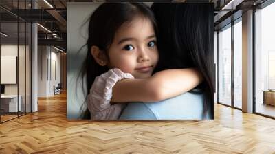 Mother and daughter hug in a beautiful moment at home. Stock photo. Wall mural