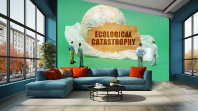 On a green background, a plastic bag, a globe and a sign with the inscription - Ecological catastrophy Wall mural