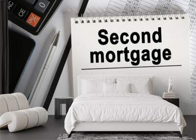 On the table lies a smartphone, a calculator and a notebook with the inscription- Second mortgage. Wall mural