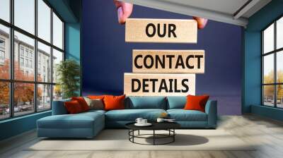 Our contact details symbol. Concept words Our contact details on wooden blocks. Businessman hand. Beautiful grey table grey background. Business our contact details concept. Copy space. Wall mural