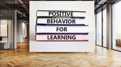 Positive behavior for learning symbol. Concept words Positive behavior for learning on books on a beautiful white background. Business, positive behavior for learning concept. Copy space. Wall mural