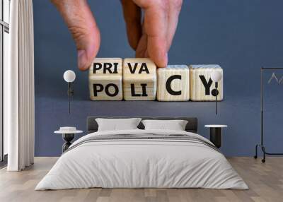 Privacy policy symbol. Hand turns the wooden cube with words 'Privacy policy' on a beautiful grey background. Business and privacy policy concept. Copy space. Wall mural