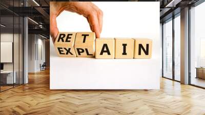 Retain or explain symbol. Businessman turns wooden cubes and changes the word explain to retain. Beautiful white background. Business, retain or explain concept. Copy space. Wall mural