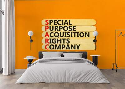 SPARC special purpose acquisition company symbol. Concept words SPARC special purpose acquisition company on wooden stick. Orange background. Business SPARC special purpose acquisition company concept Wall mural