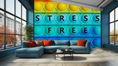 Stress free symbol. Words 'stress free' on rainbow Pop It. Beautiful background, copy space. Business, medical, psychology and stress free concept. Wall mural