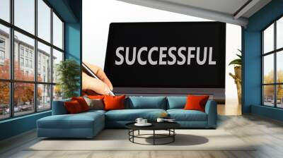 Successful symbol. Concept word Successful on beautiful black tablet. Beautiful wooden table white background. Businessman hand with pen. Business successful concept. Copy space. Wall mural