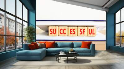 Successful symbol. Concept word Successful on beautiful wooden cubes in book. Beautiful wooden table white background. Business successful concept. Copy space. Wall mural