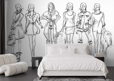 Set of young beautiful women in stylish clothes. Sale concept. Hand-drawn fashion illustration. Fashion sketch. Wall mural