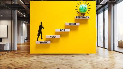 Thank you for feedback symbol. Concept words Thank you for your feedback on wooden blocks on a beautiful yellow table yellow background. Businessman icon. Business and thank you for feedback concept. Wall mural