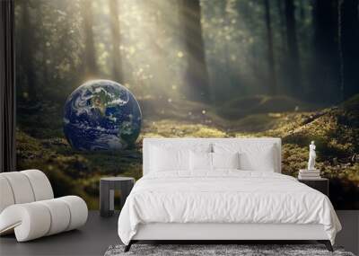 The Earth Day image shows a green globe surrounded by moss and defocused abstract sunlight Wall mural