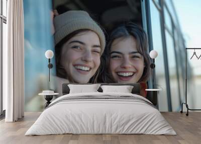 Three friends share a joyful moment on a bus amid beautiful scenery Wall mural