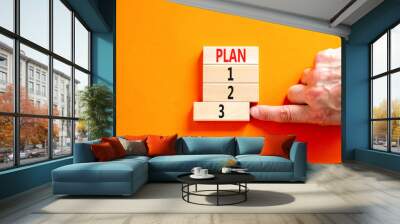 Time to plan 3 symbol. Concept word Plan 1 2 3 on wooden block. Businessman hand. Beautiful orange table orange background. Business planning and time to plan 3 concept. Copy space. Wall mural