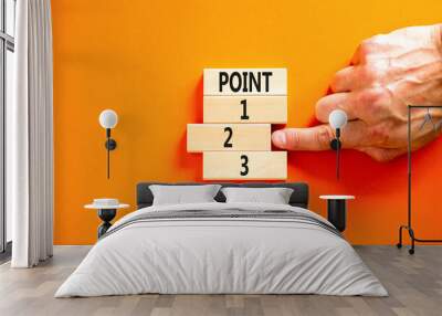 Time to point 2 symbol. Concept word Point 1 2 3 on wooden block. Businessman hand. Beautiful orange table orange background. Business planning and time to point 2 concept. Copy space. Wall mural