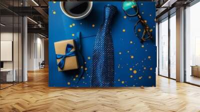 With a cup of coffee, two gift boxes, a pair of glasses, and a neatly folded blue tie on a vibrant blue background, this flat lay composition would be perfect for gift-giving, men's fashion articles, Wall mural