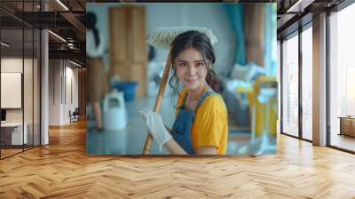 Woman in Yellow Shirt Holding Broom Wall mural