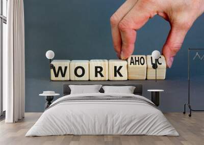 Work or workaholic symbol. Concept words Work or Workaholic on wooden cubes. Beautiful grey table grey background. Businessman hand. Business work or workaholic concept. Copy space. Wall mural