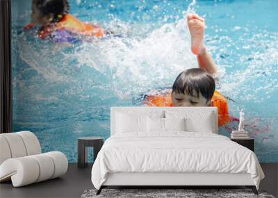 kid boy swimming pool exercise in holiday activities. swim practice sports. Wall mural